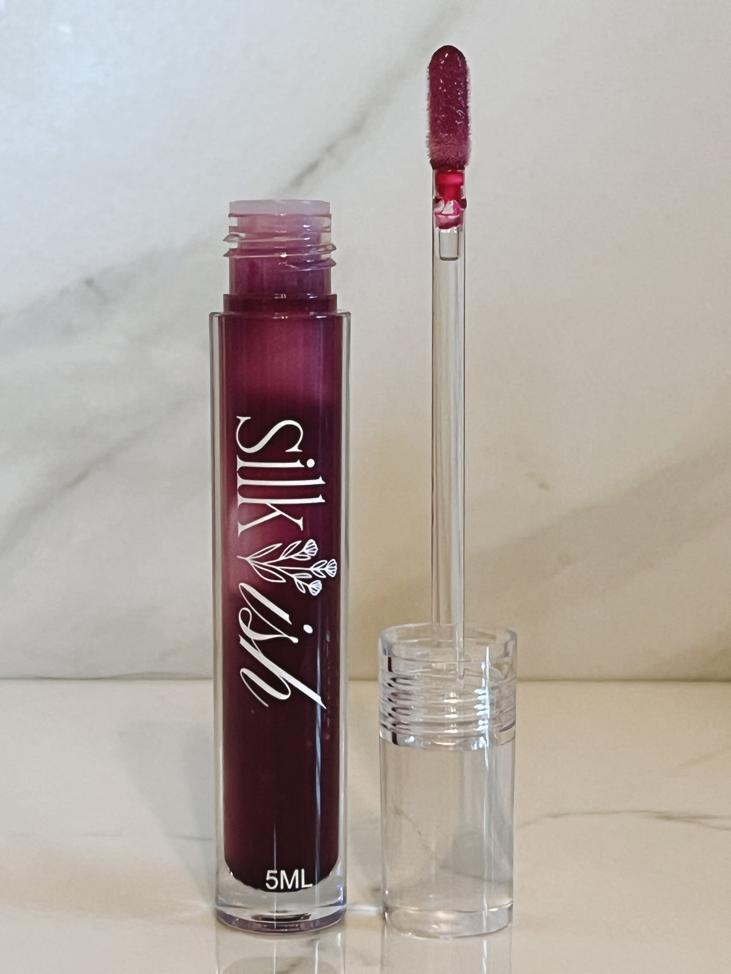 “moody” glossy color-changing lip glaze